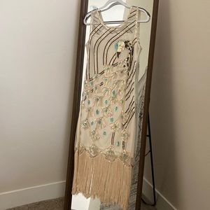 20's Flapper/Gatsby style dress. Cream color with peacock.
